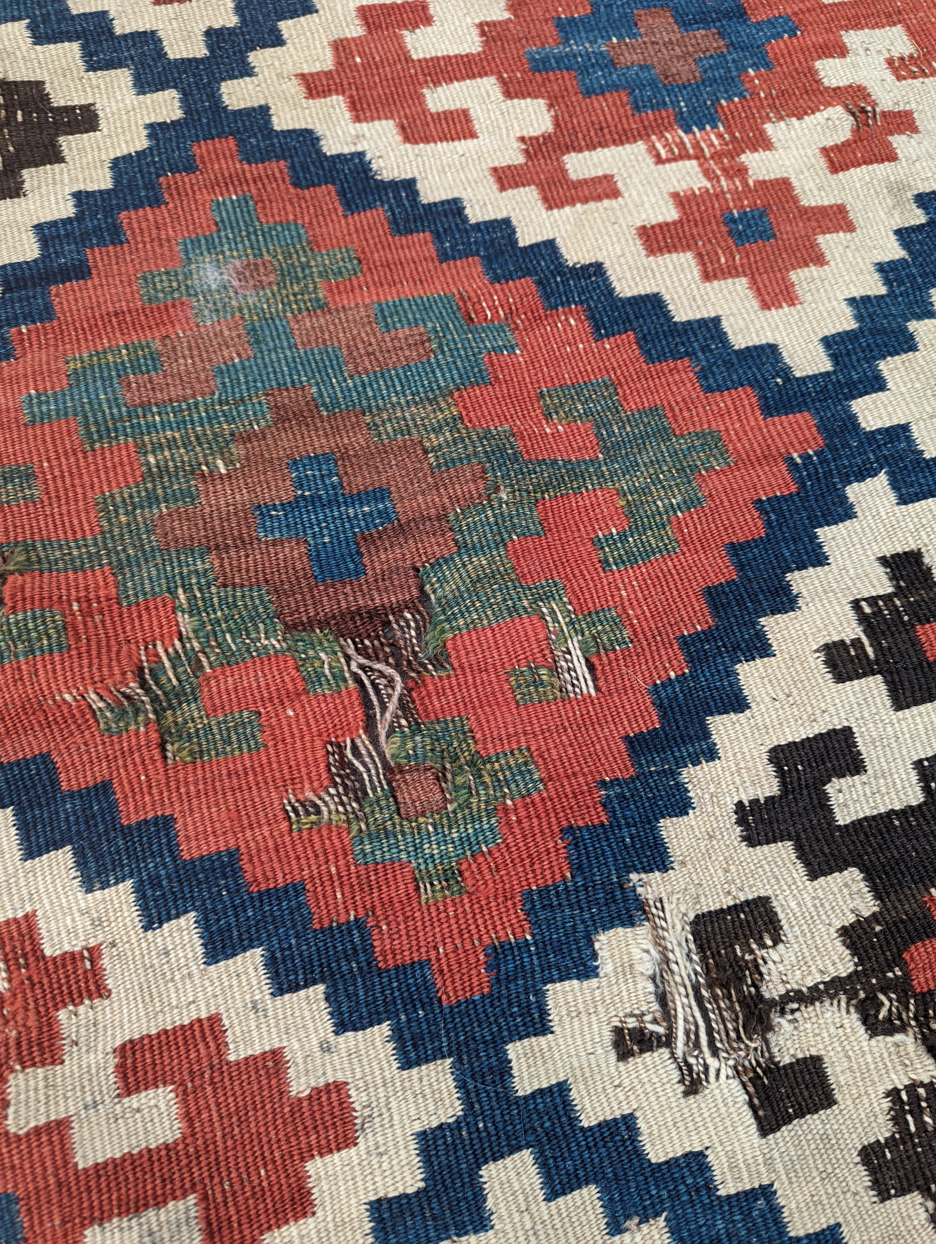 A Persian tribal Kelim carpet, 230 x 158cm and a Turkish bag